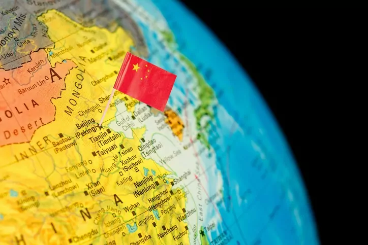 map with miniature flag of China.Selective focus on Chinese Flag.  Detail Globe Backlit lighting.